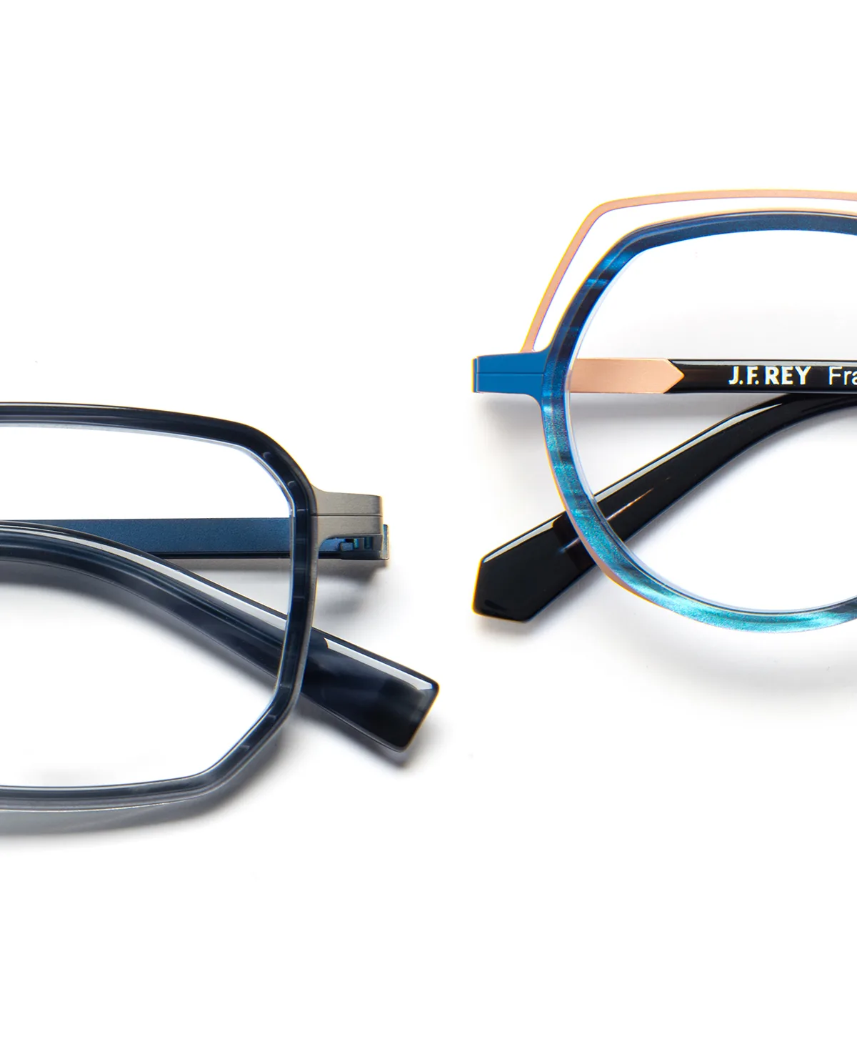Detail of two J.F. Rey frames showing metal lines following the contours of dark blue and turquoise fronts