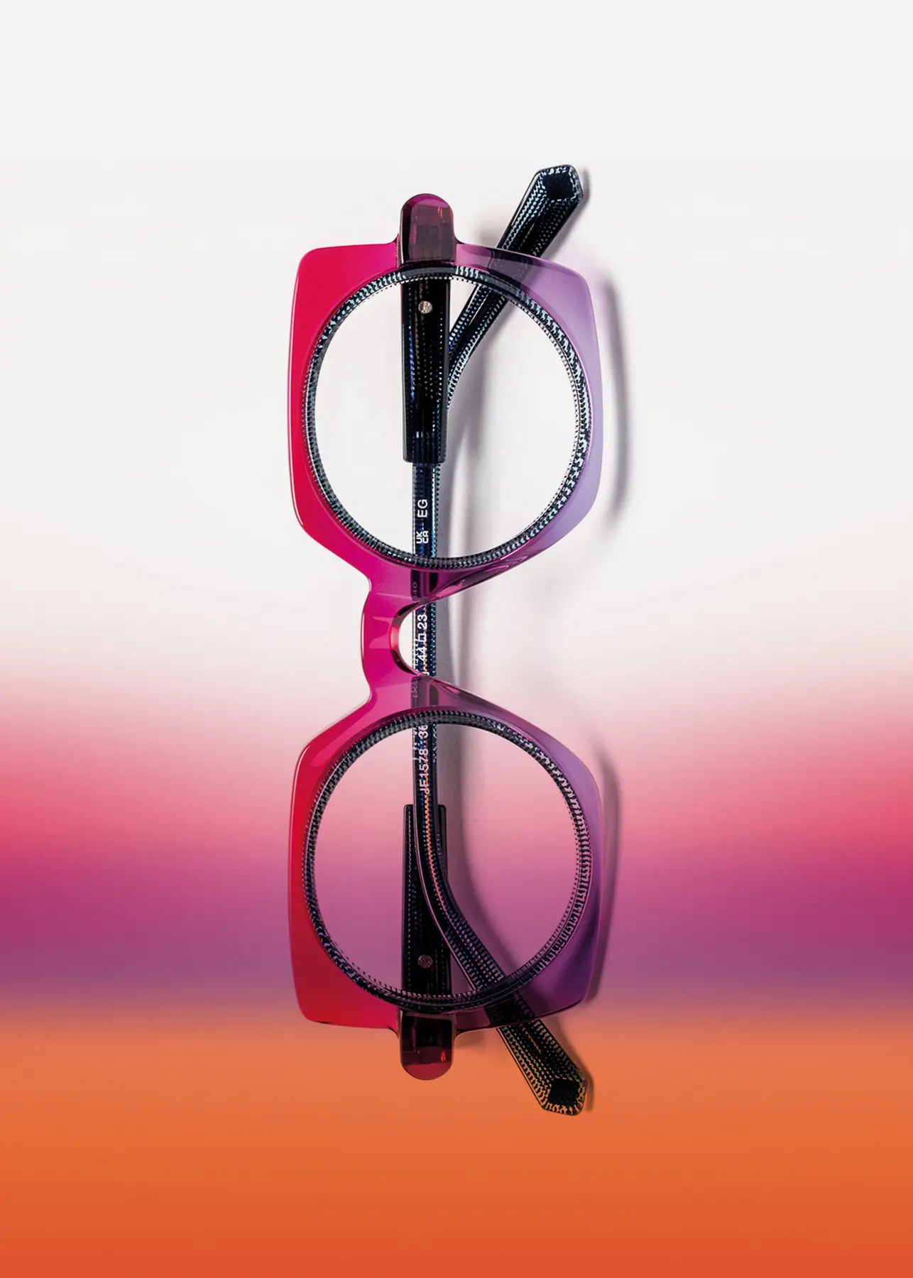 J.F. Rey Designed to Fit optical still-life image with a frame on a gradient background