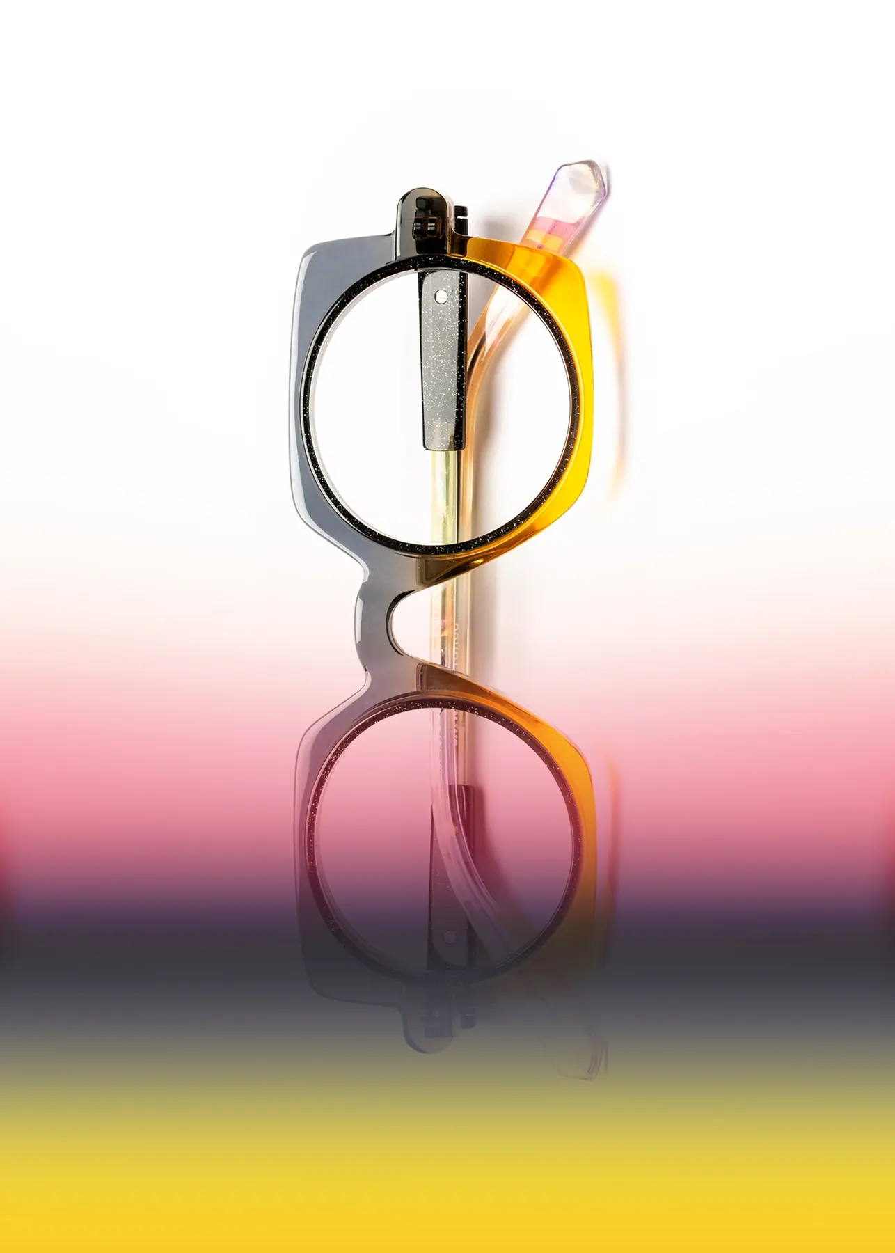 J.F. Rey optical still-life image with a frame on a warm gradient background