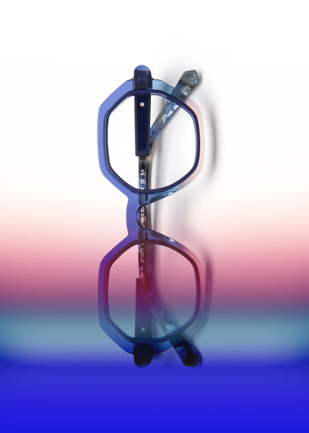 J.F. Rey optical still-life image with a frame on a blue gradient background