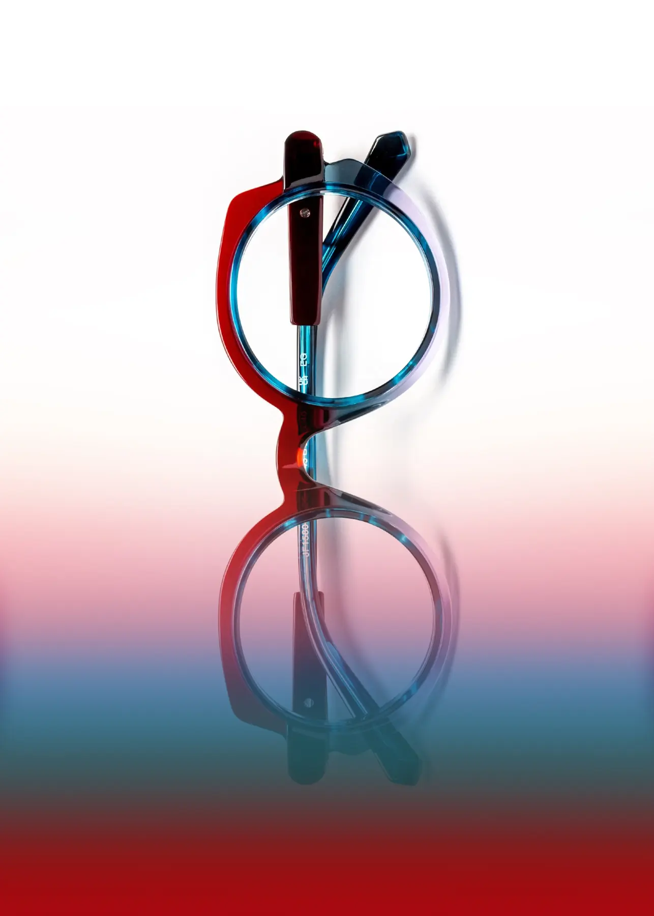 J.F. Rey optical still-life image with a multicolor frame on a gradient background