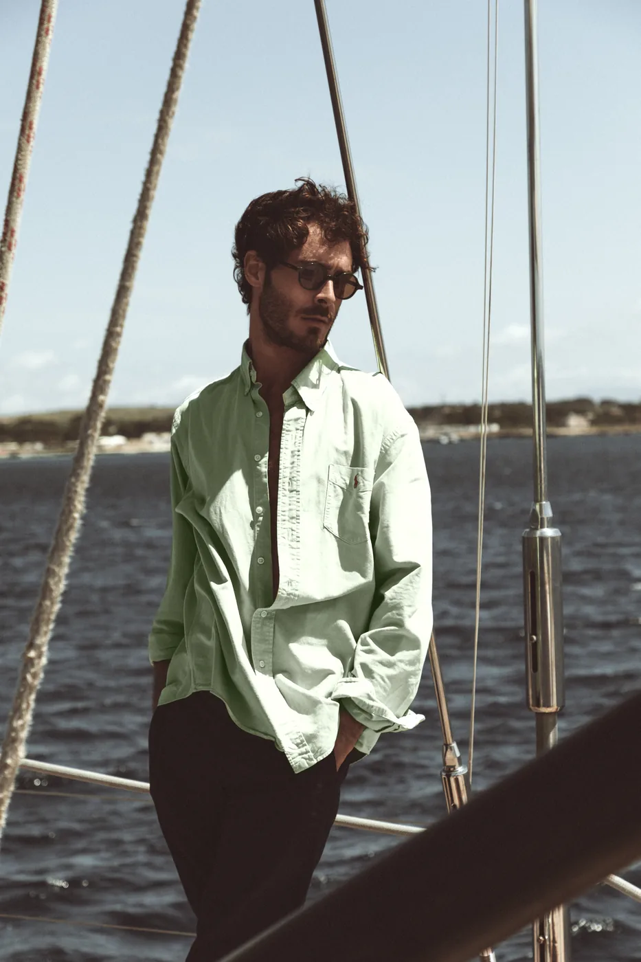 L.G.R GONE campaign image with a model wearing sunwear aboard a sailboat