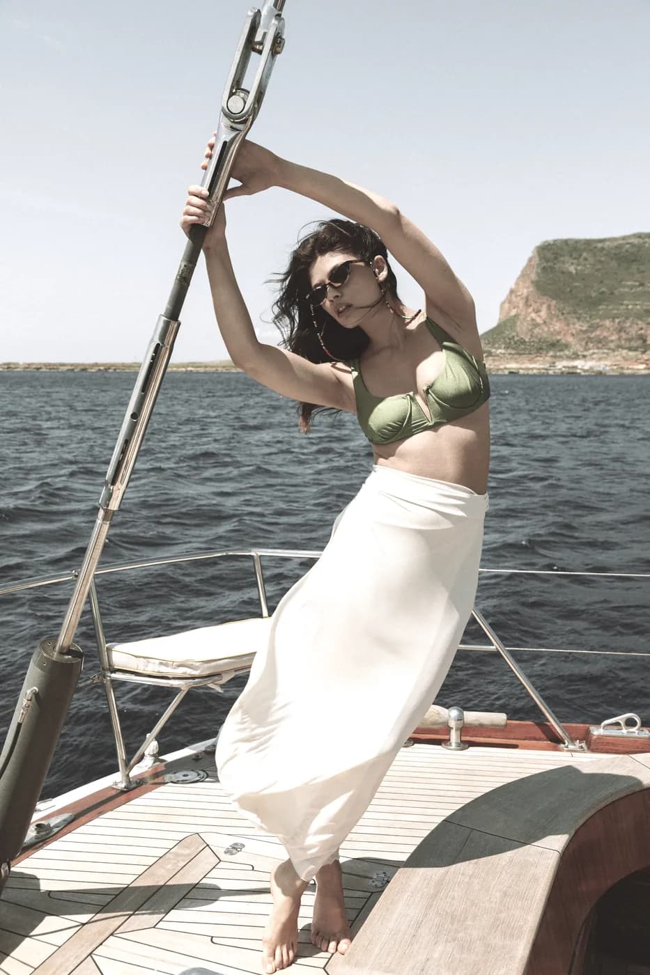 L.G.R GONE campaign image with a model wearing sunwear on a boat