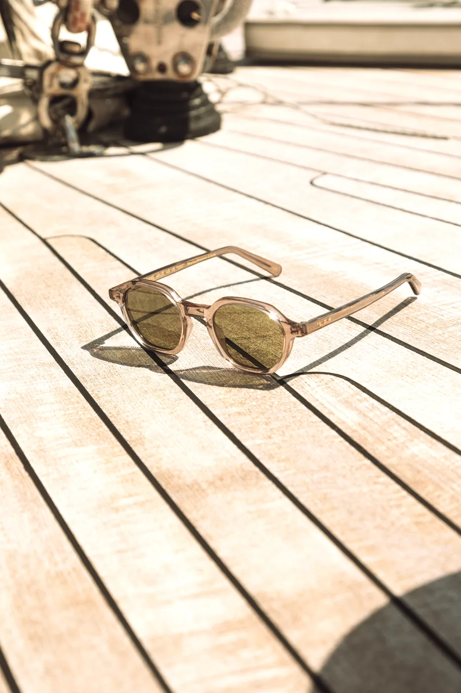 L.G.R GONE still-life image with sunglasses on a boat deck