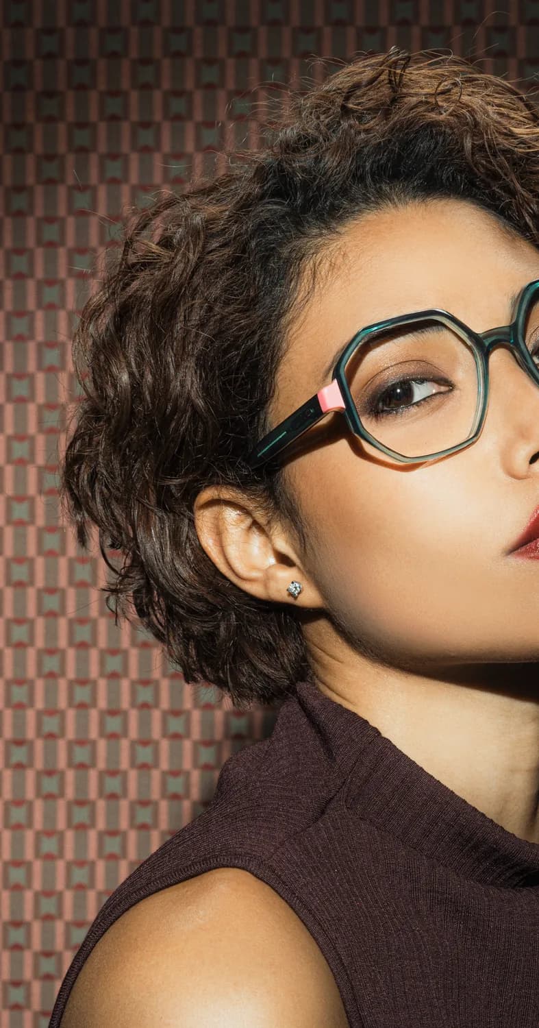 VANNI S/S 2026 optical campaign portrait with a model wearing a teal frame