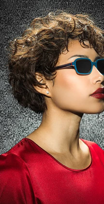 Vanni S/S 2026 sun campaign portrait with a model wearing blue sunwear
