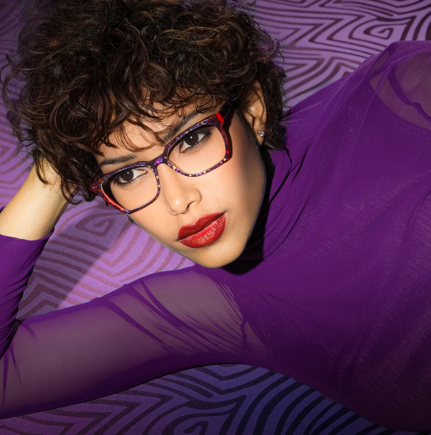 Vanni S/S 2026 optical campaign image with a model wearing a purple frame