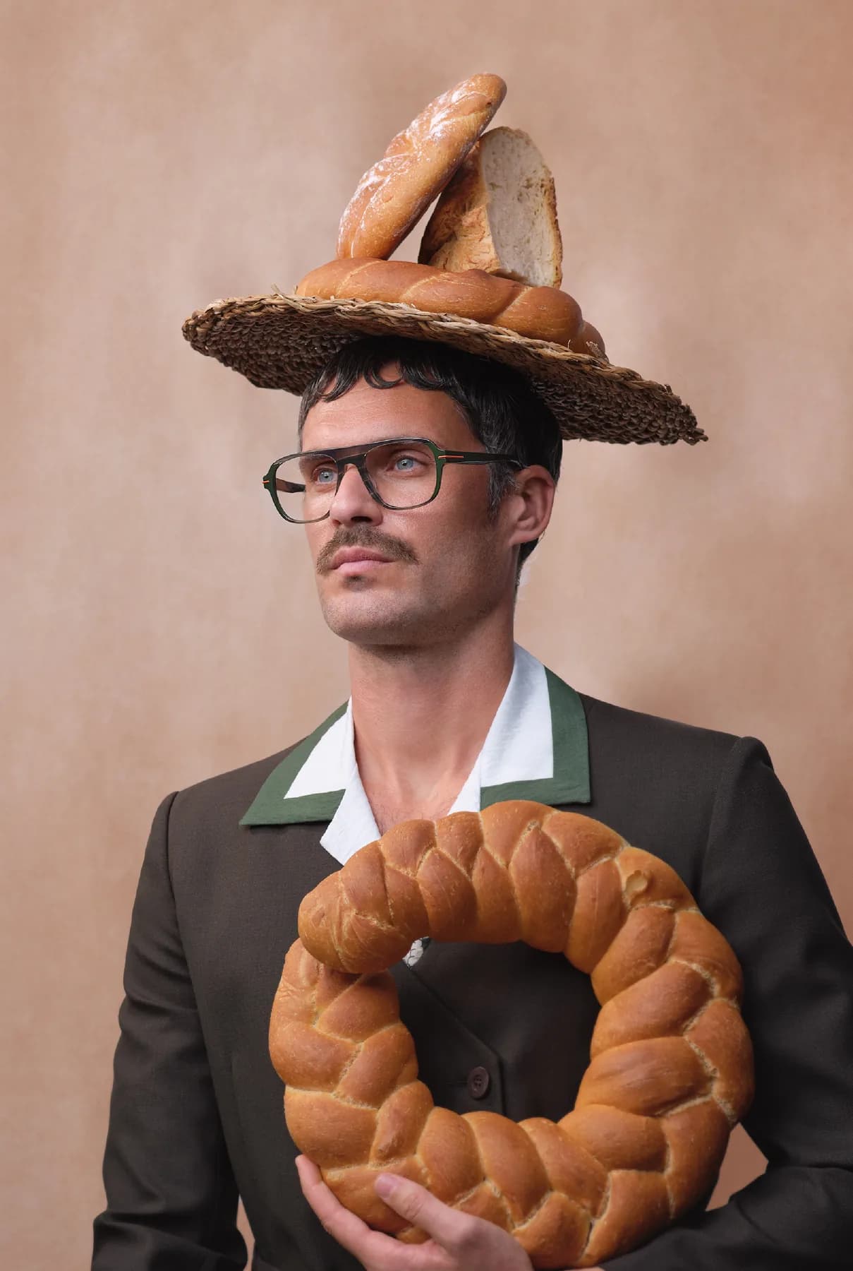 Woodys Unique Bakery SS26 optical campaign image with a model wearing a dark frame