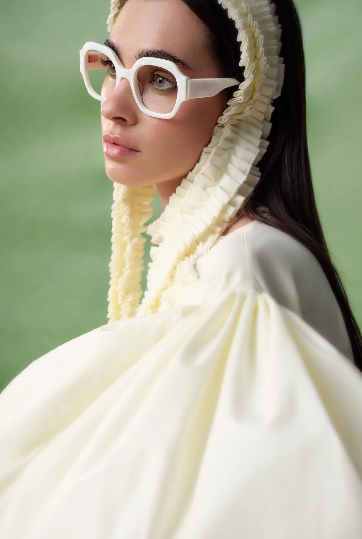 Woodys Unique Bakery SS26 optical campaign image with a model wearing a white frame