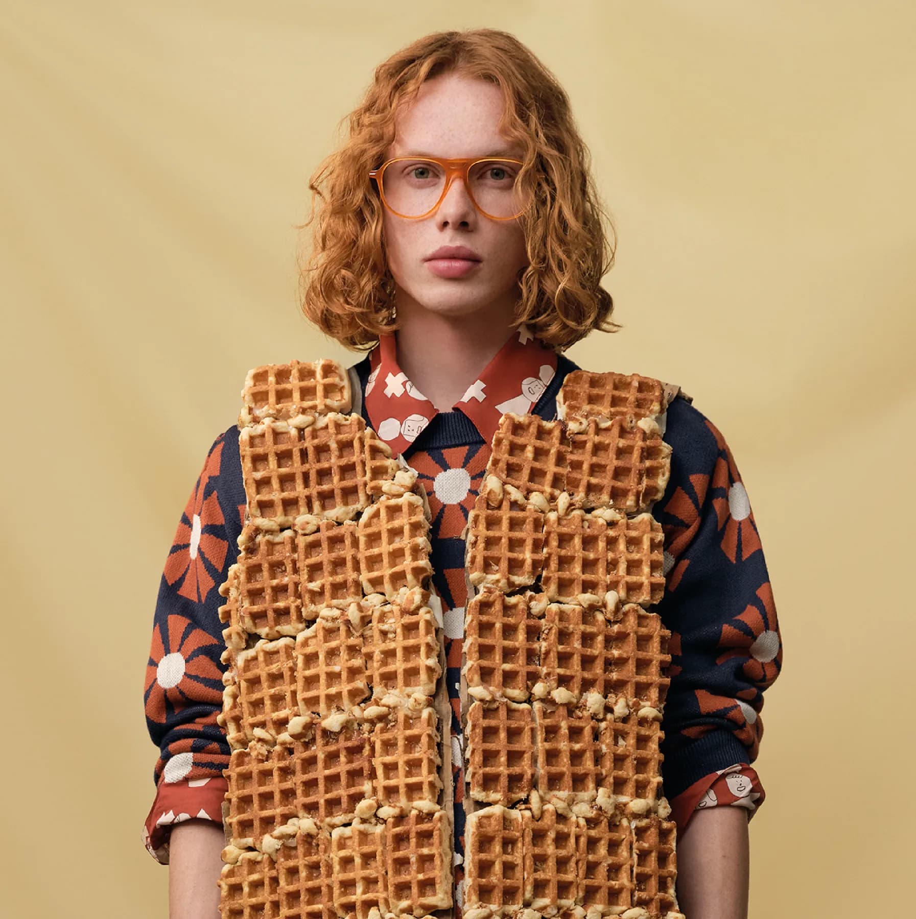 Woodys Unique Bakery SS26 optical campaign image with an amber frame and waffle styling