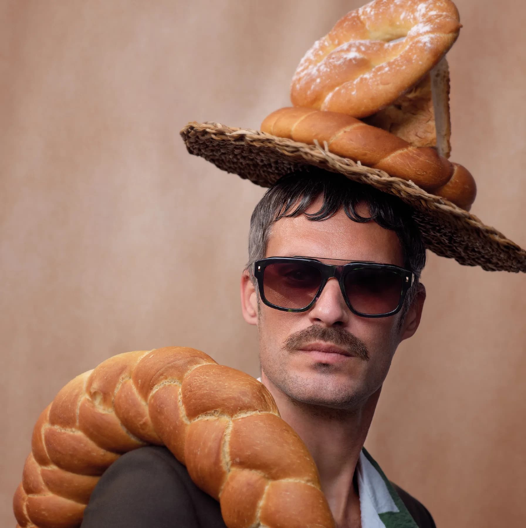 Woodys Unique Bakery SS26 sunglasses campaign image with a model in bakery styling
